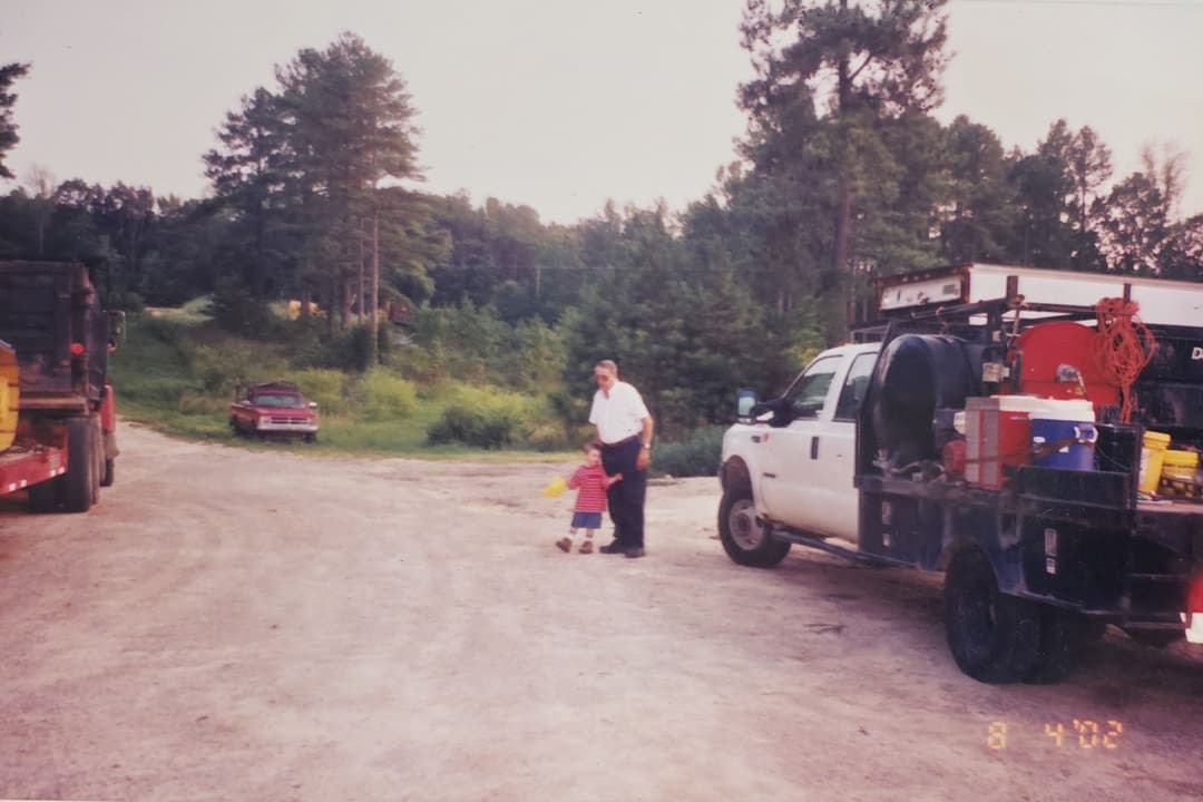 Me and Granddaddy at the shop. I didn’t realize it then, but I was learning what real work, faith, and character looked like just by standing next to him