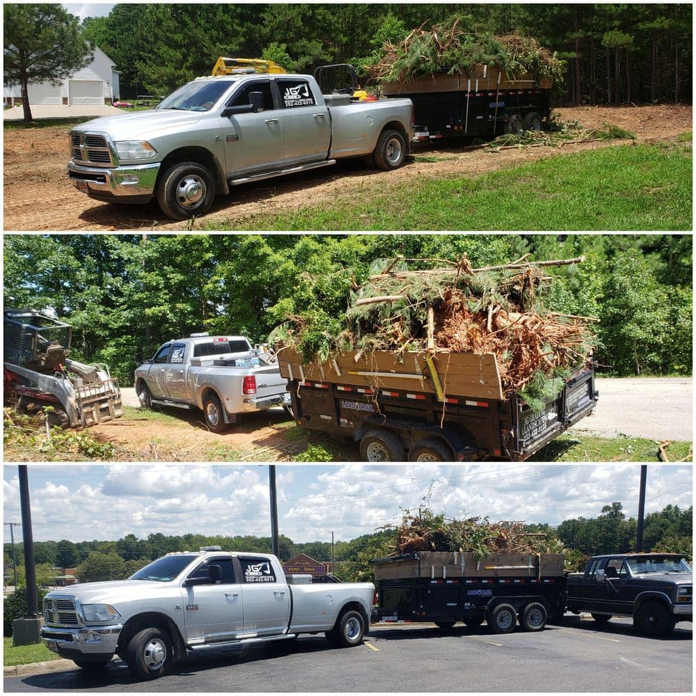 Truck hauling a trailer loaded with tree debris in a rural setting.