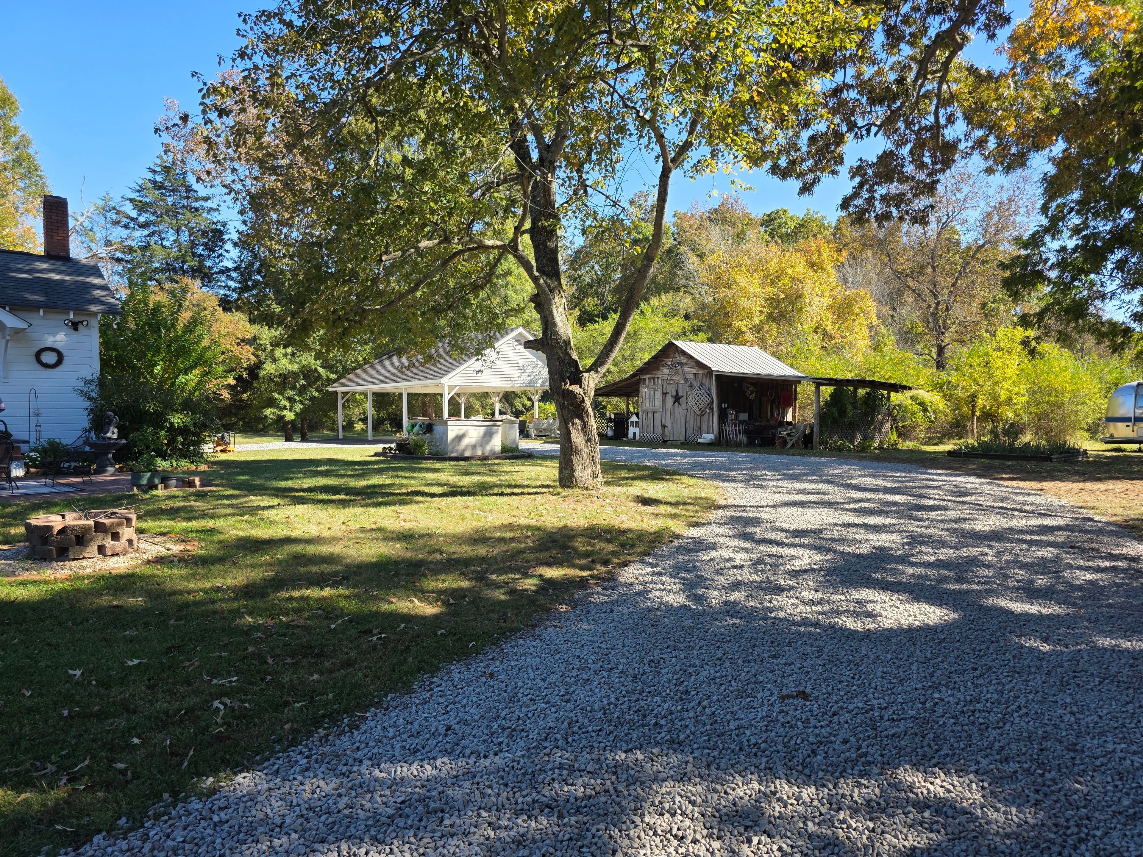 Gravel driveway finished near barn and carport after grading and stone work in Oak hill Township N.C.
