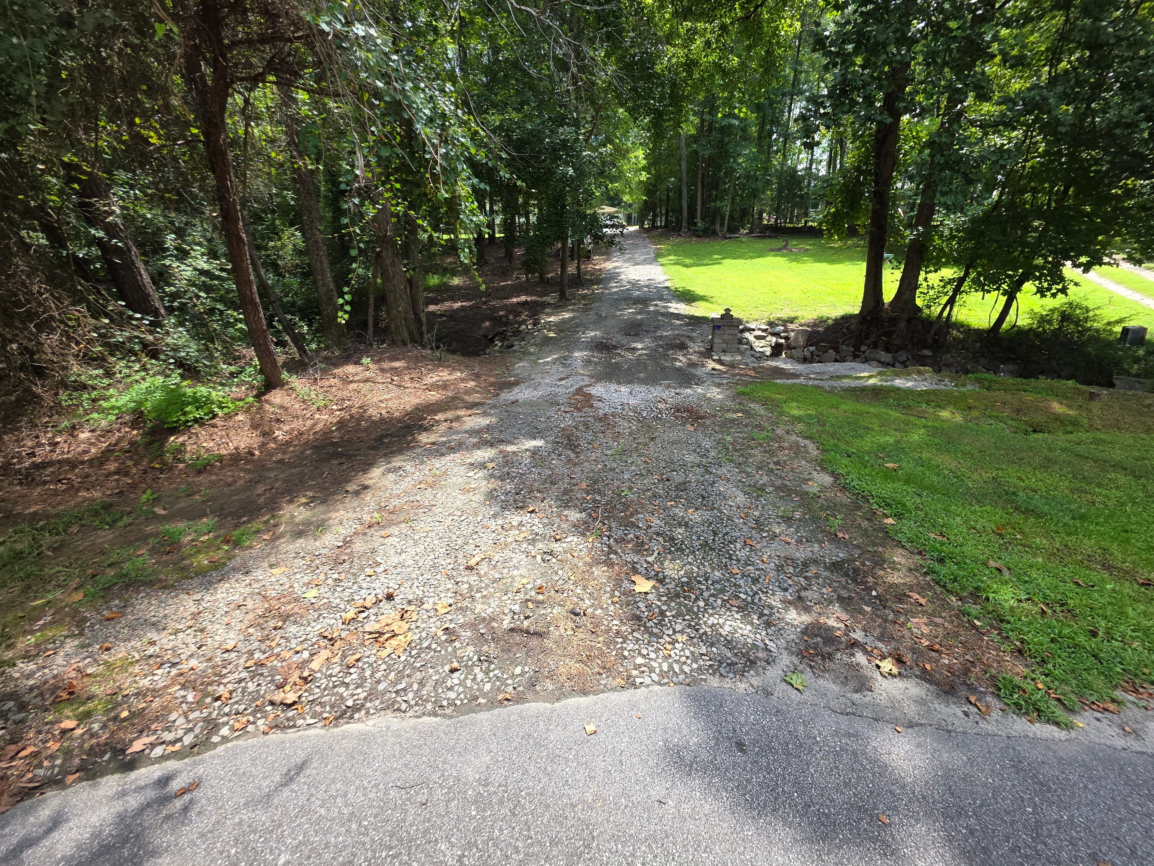 Washed out Driveway before gravel driveway cleanup and regrading
