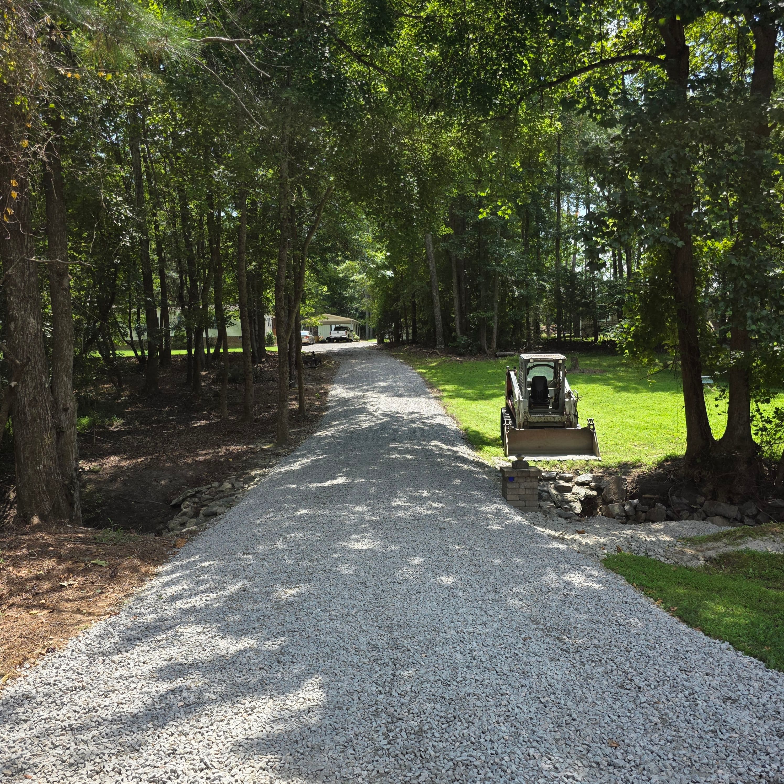 Gravel driveway entrance after fresh stone and grading work